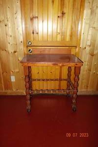 lot 60 image: Wooden Desk by utility closed on castors 36x23x35.5