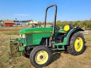 lot 1 image: 1997 John Deere 5400N with 6 45 KG Weights