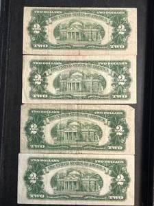 lot 83 image: GROUP OF 4 US RED SEAL $2 BILLS
