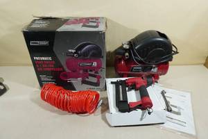 lot 103 image: Tool Shop Pneumatic Brad Nailer with 1 Gallon Air Compressor