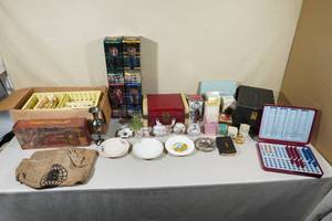lot 307 image: Large Assortment of Collectibles -Avon Makeup, NSYNC Bobbleheads, Glassware