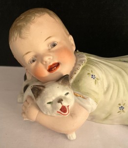 lot 77 image: Vintage Piano Baby Porcelain Figurine
