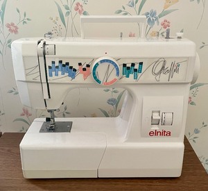 lot 341 image: Elnita Sewing Machine with Singer Tote Bag