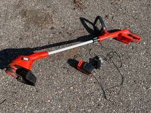 lot 409 image: Black and Decker 18 Volt Rechargable Weed Whip Model NST2118