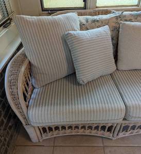 lot 250 image: Wicker Sofa and Glass Topped Side Table