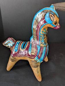 lot 513 image: Carved Wood Hornbill from Borneo and Painted Horse Bank from Mexico