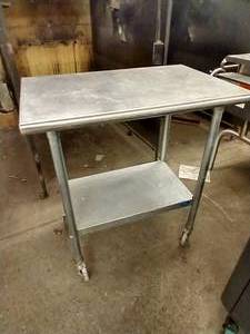 lot 128 image: Rolling Stainless Steel TableCart
