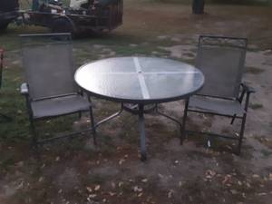 lot 13 image: Glass top patio table with two chairs