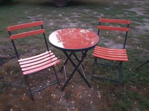 lot 14 image: Red glass top patio table with two chairs