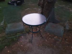 lot 15 image: Two metal patio chairs and small glass top table