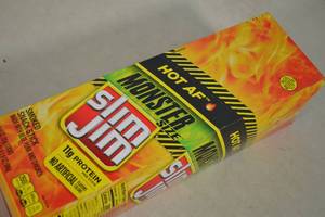 lot 43 image: Box of Slim Jim Meat Sticks Monster Size Hot AF