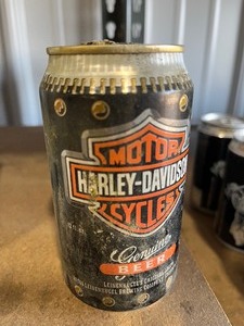 lot 40 image: 5 cans  1999 Rally Sturgis beer