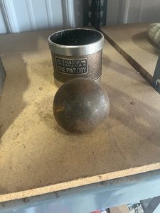 lot 10 image: 1 pint cup and cast ball
