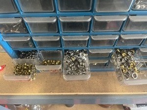 lot 29 image: organizer full of snap buttons and hardware