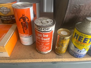 lot 44 image: Vintage heat cans Harley Davidson Spark Plugs and oil  other Cans