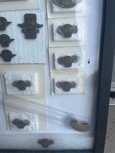 lot 75 image: Framed Collection  of Harley Davidson pins