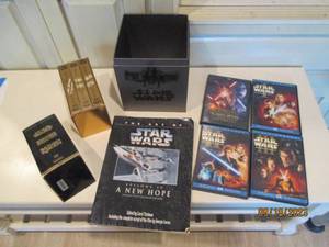 lot 68 image: Star Wars VHS, DVDs and Information...