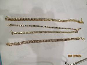 lot 101 image: Gold-Toned Tennis and Other Bracele...