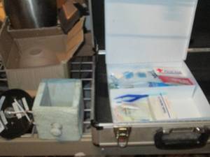 lot 890 image: Briefcase, metal first aid kit with...