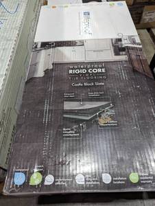 lot 21 image: Lifeproof Castle Black Slate 6 MIL x 12 in. W x 24 in. L Click Lock Waterproof Vinyl Tile Flooring (42 sqft)