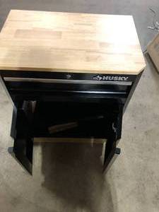 lot 15 image: Husky Ready-to-Assemble 24-Gauge Steel 1-Drawer 2-Door Garage Base Cabinet in Black (28 in. W x 33 in. H x 18 in. D) Customer Returns See Pictures