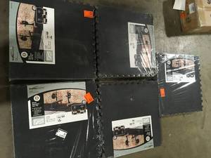lot 44 image: Lot of new TrafficMaster Black with Blue Flecks 25.2 in. x 25.2 in. x 0.68 in. Foam Shock Absorbing Gym Floor Tiles(4 TilesPack) (17.64 sq. ft.) see pictures