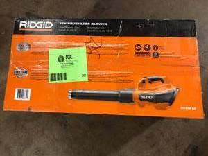 lot 38 image: RIDGID 18V Brushless 130 MPH 510 CFM Cordless Battery Leaf Blower (Tool Only)   Customer Returns See Pictures