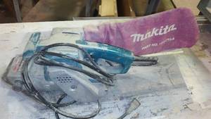 lot 885 image: Makita Belt Sander.