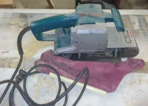 lot 932 image: Makita Belt Sander.