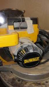 lot 1030 image: DeWalt Miter Saw For Parts Or Repair.