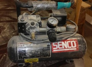 lot 1032 image: SENCO 1 Gallon Air Compressor Parts Or Repair.