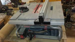 lot 1046 image: Bosch Table Saw. Blade Adjustment Needs New Piece.