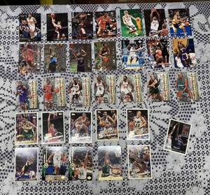 lot 17 image: Collection of 32 Topps Basketball Cards-1990s, 39 Topps Football Cards-1990s, and More than 50 Topps Baseball Cards