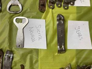 lot 33 image: Assorted Bottle Openers including Sierra Nevada Brewing Co., Sears, Old Style, Pabst, Quick & Easy, and Assorted Paint Can Openers