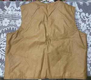 lot 40 image: Vintage Fingerhut Tan Vest, Vintage Hand-Held Electric Hair Dryer, and a New Hot Water Bottle
