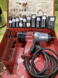 lot 50 image: Heavy-Duty Milwaukee 12-inch Electric Impact Gun with SAE and Metric Impact Sockets in Original Steel Case