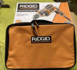 lot 51 image: New Rigid 38-inch Variable Speed Electric Drill in the Original Box and Carrying Case