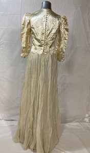 lot 76 image: Vintage Wedding Dress - Sustained some damage over time to a sleeve and another part of the dress, see photos