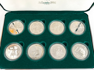 1996  U.S. Olympic Coins of The Atlanta Centennial Olympic Games. Eight (8) Proof Silver Commemorative Dollars In Original Packaging