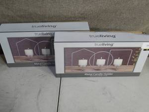 lot 39 image: Two Metal Candle Holders - Silver