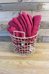 lot 1 image: Basket full of Red Bath Towels