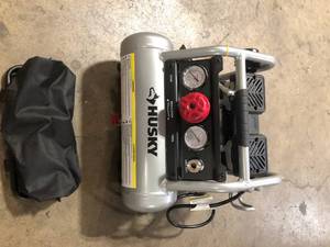 lot 7 image: Husky 1 Gal. Portable Electric-Powered Silent Air Compressor Customer Returns See Pictures