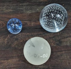 Three Paperweights
