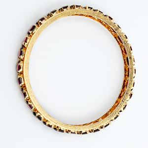 Hand assembled, Yellow Plated Metal Slip-On Bangle Bracelet. Set With Garnets