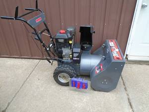 lot 105 image: Swisher 824 snow blower. Very clean. Looks hardly used. Starts on first pull. Tested & works. THIS ITEM HAS A RESERVE.