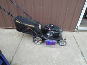 lot 110 image: Yard Man push mower with bag. Nice condition. Tested & works. As shown.