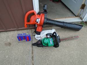 lot 119 image: Weed Eater hedge trimmer & Black & Decker 110 volt blower vac. As shown.