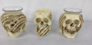 lot 285 image: Set of Skull Candle Holders