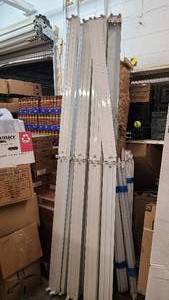Large set of used overhead florescent lighting and bulbs.