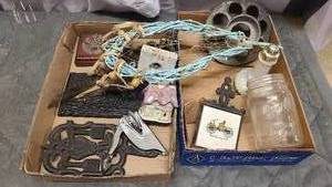 Selection of antique cast iron decor and dreamcatchers